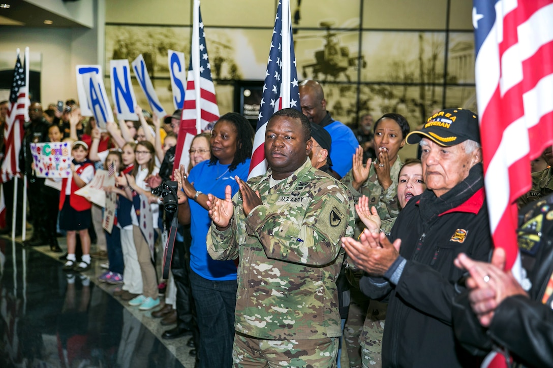 Veterans, active duty military and civilians welcome wounded warriors.
