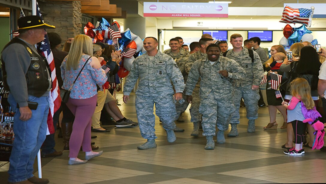 Airmen greeted by family and members of the Arkansas Patriot Guard