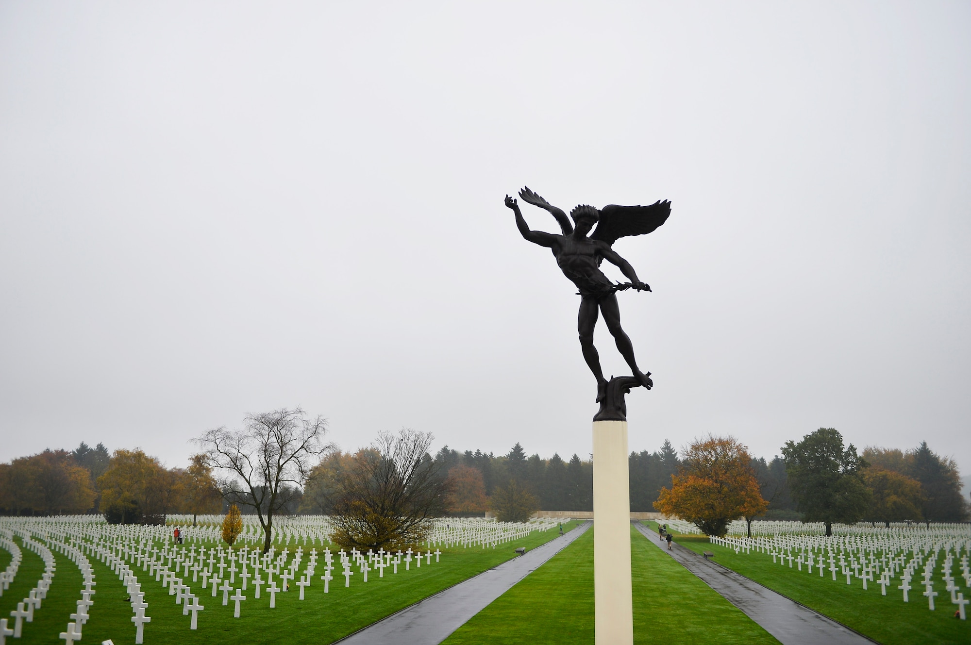 A statue towers above Henri-Chapelle American Cemetery and Memorial, Belgium, Nov. 11, 2017. The cemetery serves as the resting place for 7,992 Americans who fought in World War II. (U.S. Air Force photo by Airman 1st Class Joshua Magbanua)