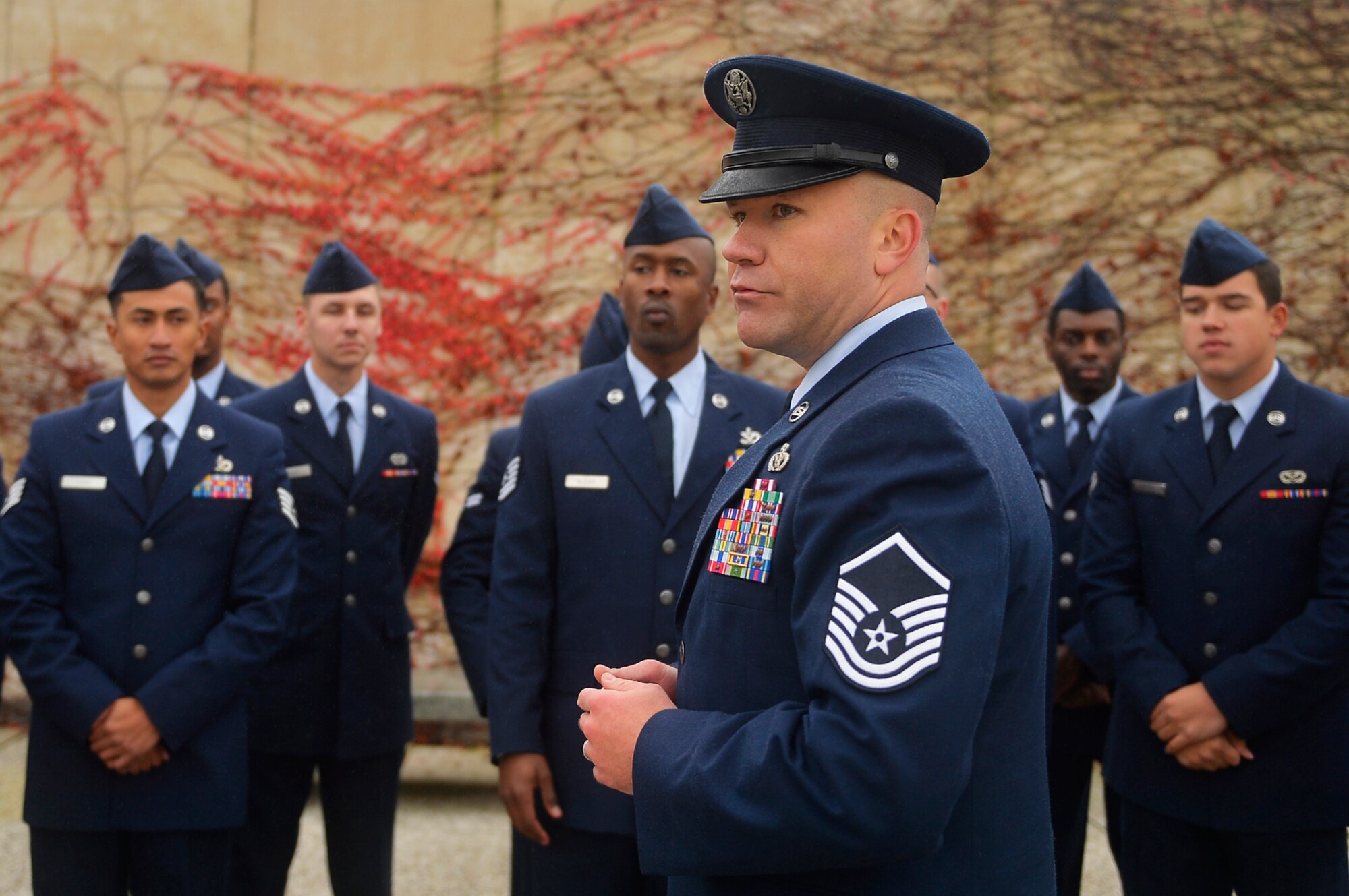 U.S. Air Force Master Sgt. Michael Murieen, 786th Civil Engineer Squadron water and fuel systems maintenance section chief, briefs a group of Airmen prior to a Veterans Day ceremony at Henri-Chapelle American Cemetery and Memorial, Belgium, Nov. 11, 2017. Veterans Day is a public holiday which recognizes U.S. veterans of all wars. (U.S. Air Force photo by Airman 1st Class Joshua Magbanua)