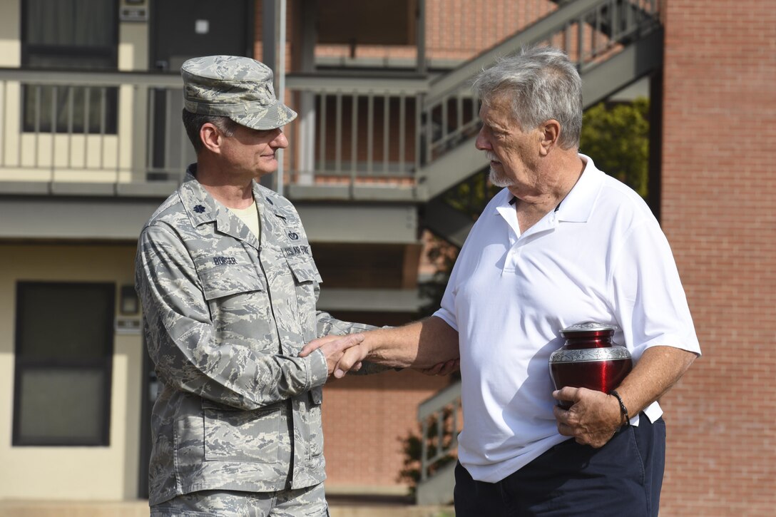 U.S. Air Force Lt. Col. Robert Borger, 17th Training Wing chaplain, greets Ron Cichon who spread his mother’s ashes where the movie theater was once located at Goodfellow Air Force Base, Texas, Nov. 6, 2017. Borger said a few words and a prayer before the ceremony. (U.S. Air Force photo by Airman 1st Class Zachary Chapman/Released)
