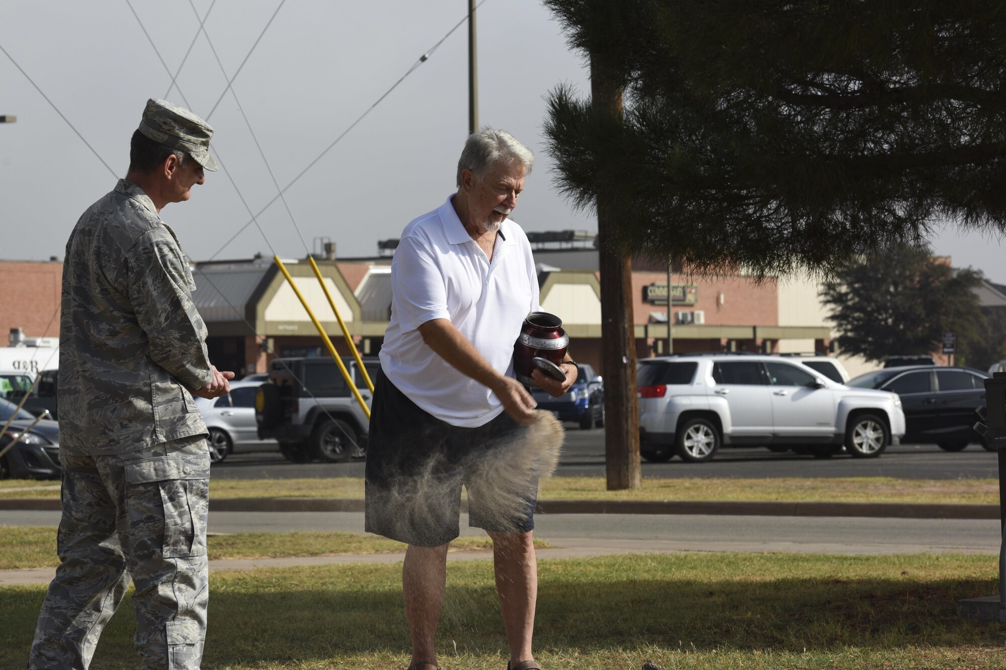 Ron Cichon spread his mother’s ashes where the movie theater once stood on Goodfellow Air Force Base, Texas, Nov. 6, 2017. Ron spread the ashes once for each of his mother’s eight children during a small ceremony. (U.S. Air Force photo by Airman 1st Class Zachary Chapman/Released)