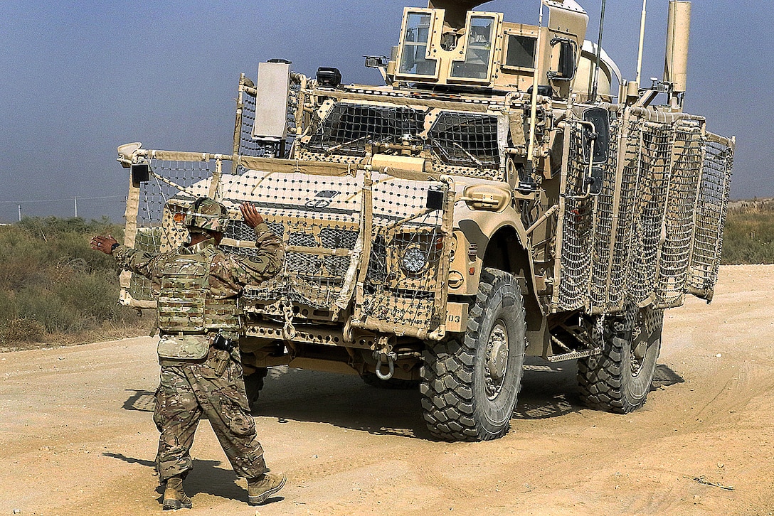 Staff Sgt. Arturo Amaro guides a mine-resistant, ambush-protected vehicle before the off-road portion of the master driver training course.