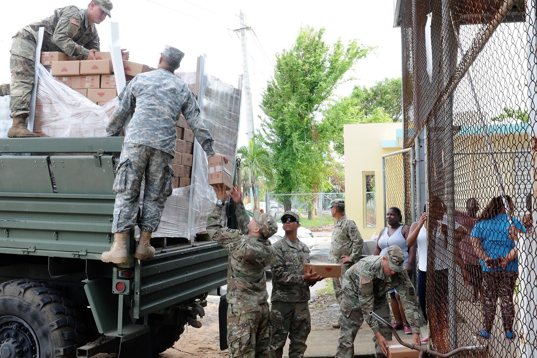 National Guard soldiers arrive with supplies.