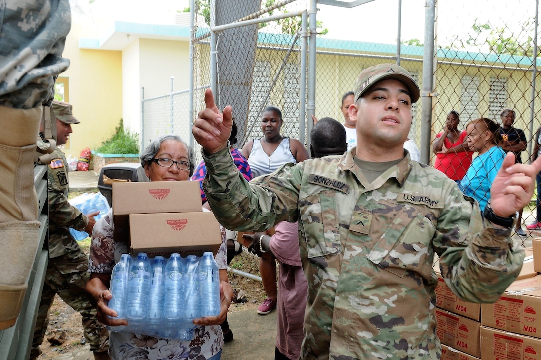Soldiers hand out supplies