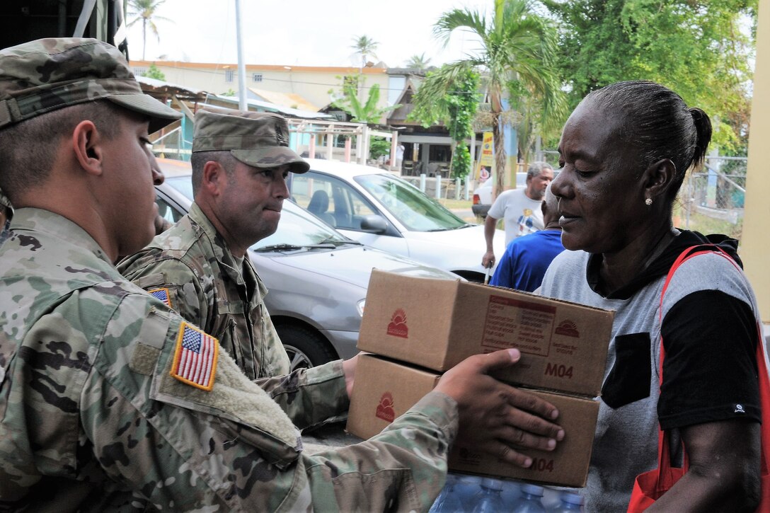 Soldiers deliver food and water.
