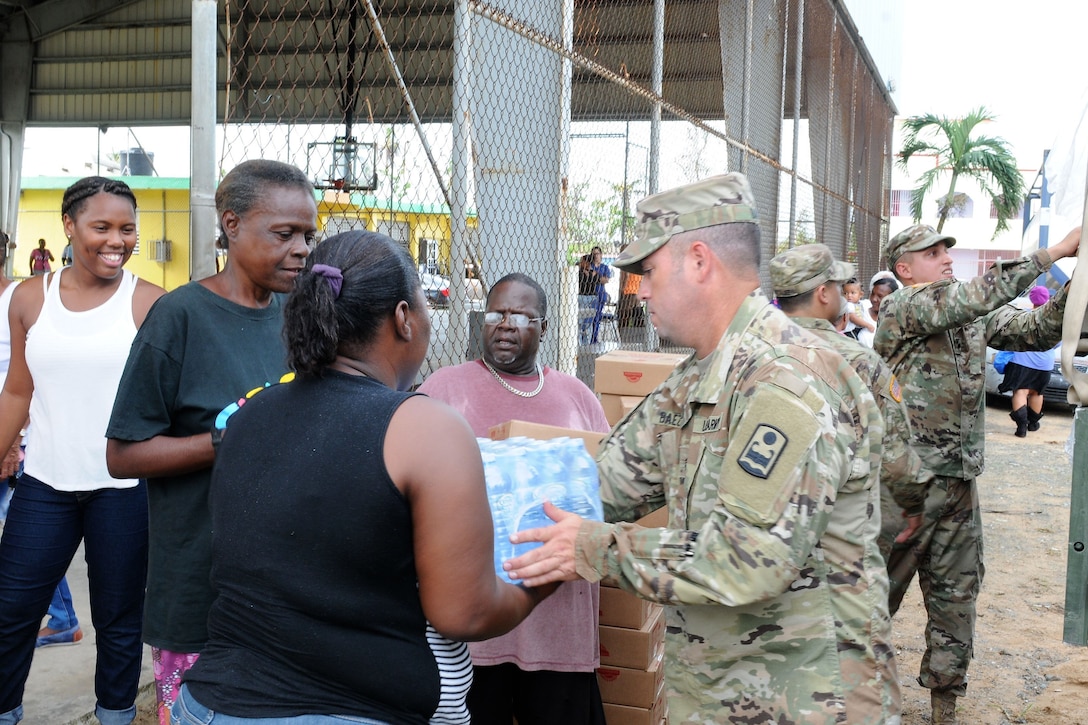Puerto Rican residents receive aid.