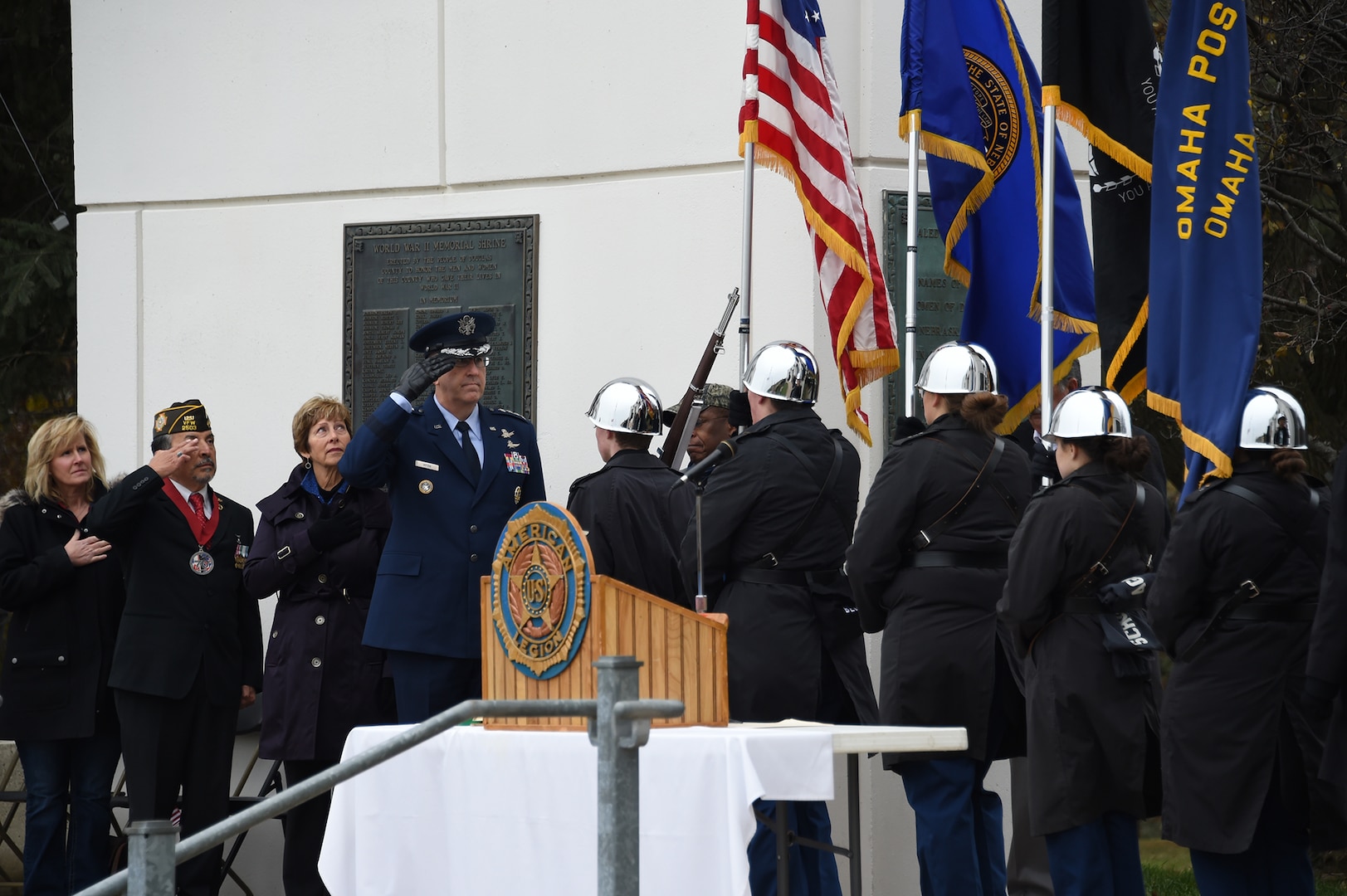 U.S. Air Force Gen. John Hyten, commander of U.S. Strategic Command, and other distinguished guests pay respects to the United States flag during a Veterans Day ceremony at Memorial Park in Omaha, Neb., Nov. 11, 2017. More than 200 people attended the ceremony to honor the service and sacrifice of American veterans and their families.