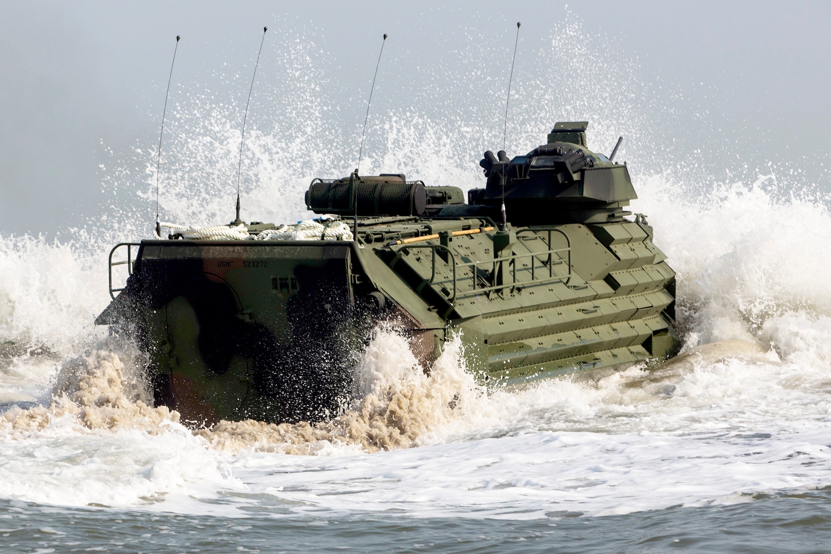 U.S. Marines with the 4th Amphibious Assault Vehicle Battalion take on crashing waves from the shores of Dogu Beach during a training exercise in March 2016. Exercises like this one help warfighters prepare for enemy action and give DLA the chance to rehearse logistics support.