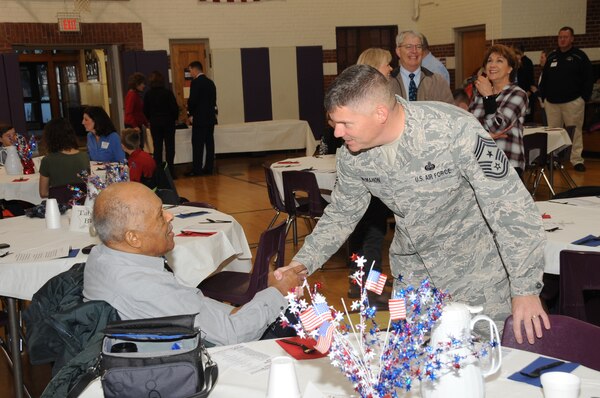 U.S. Air Force Chief Master Sgt. Patrick McMahon, senior enlisted leader of U.S. Strategic Command (USSTRATCOM), speaks with a veteran before the 2017 Bellevue Veterans Day Parade in Bellevue, Neb., Nov. 11, 2017. Senior leaders from USSTRATCOM and the 55th Wing participated in several Veterans Day events throughout the Omaha area to honor the service and sacrifice of American veterans and their families.