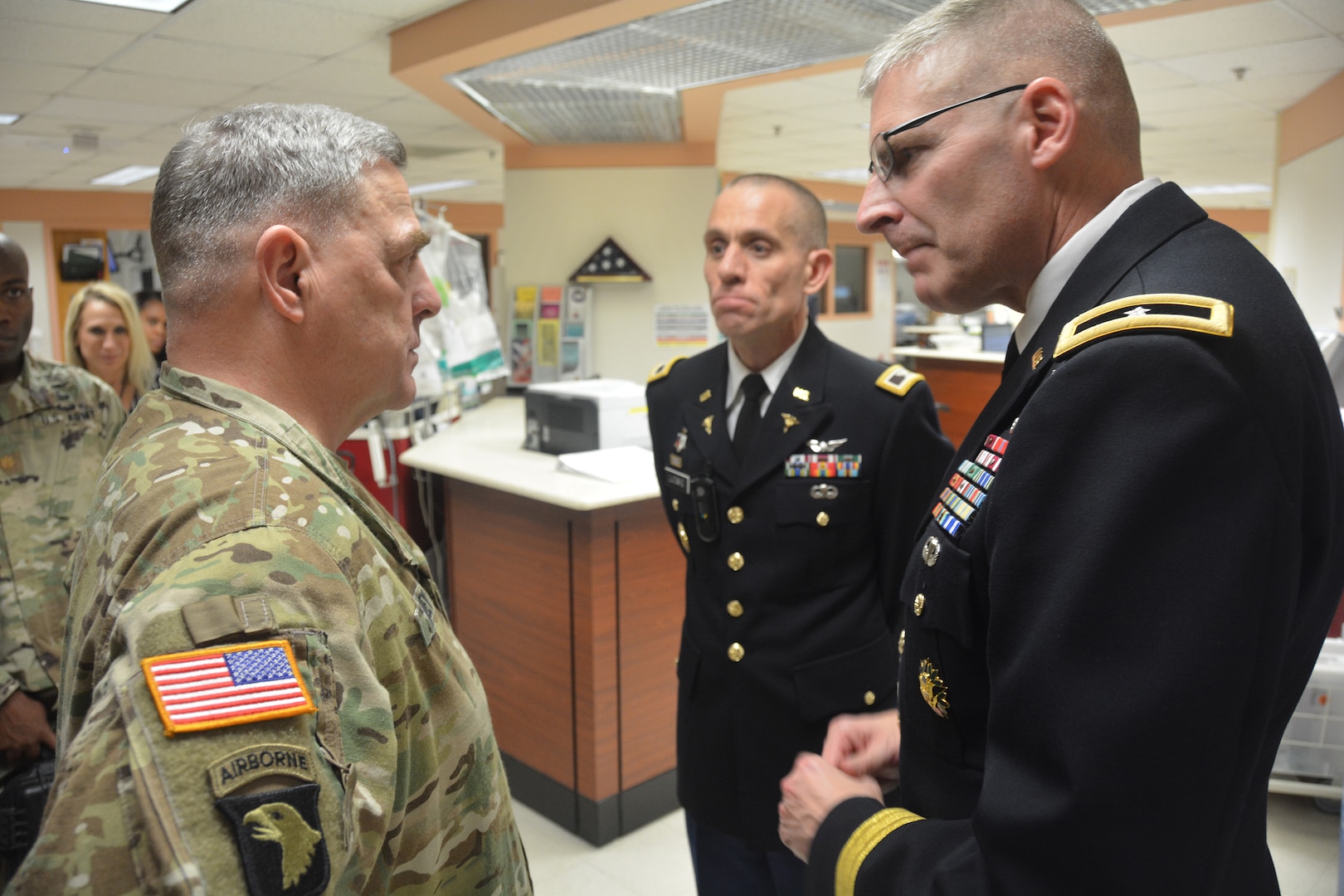 Brooke Army Medical Center Commanding General Brig. Gen. Jeffrey Johnson (right) discusses the BAMC trauma mission with U.S. Army Chief of Staff Gen. Mark A. Milley Nov. 11, 2017 as Col. Michael Ludwig, deputy commander for Inpatient Services, looks on. Milley spent Veterans Day visiting with patients and staff at BAMC.