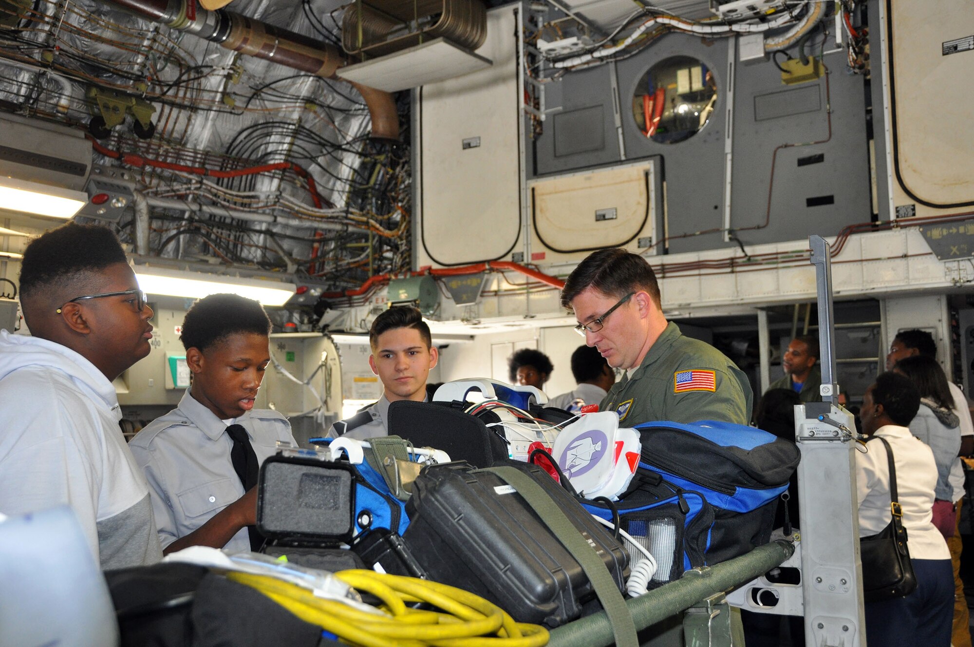 Master Sgt. Kiley Gerritsen, 445th Aeromedical Evacuation Squadron medical technician, shows students from Thurgood Marshall and Meadowdale High Schools some of the equipment his squadron uses when flying on an AE mission. (U.S. Air Force photo/Stacy Vaughn)