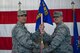 Col. John Chastain III, 23d Maintenance Group commander, left, presents Lt. Col. Neal Van Houten, 23d Maintenance Squadron commander, with the 23d MXS guidon during a re-designation ceremony, Nov. 9, 2017, at Moody Air Force Base, Ga. Van Houten took command of Air Combat Command’s second largest squadron, leading the 800 men and women who are responsible for executing safe and reliable maintenance on aircraft systems, ground equipment and munitions to support the 23d Wing's attack and rescue missions. (U.S. Air Force photo by Senior Airman Greg Nash)