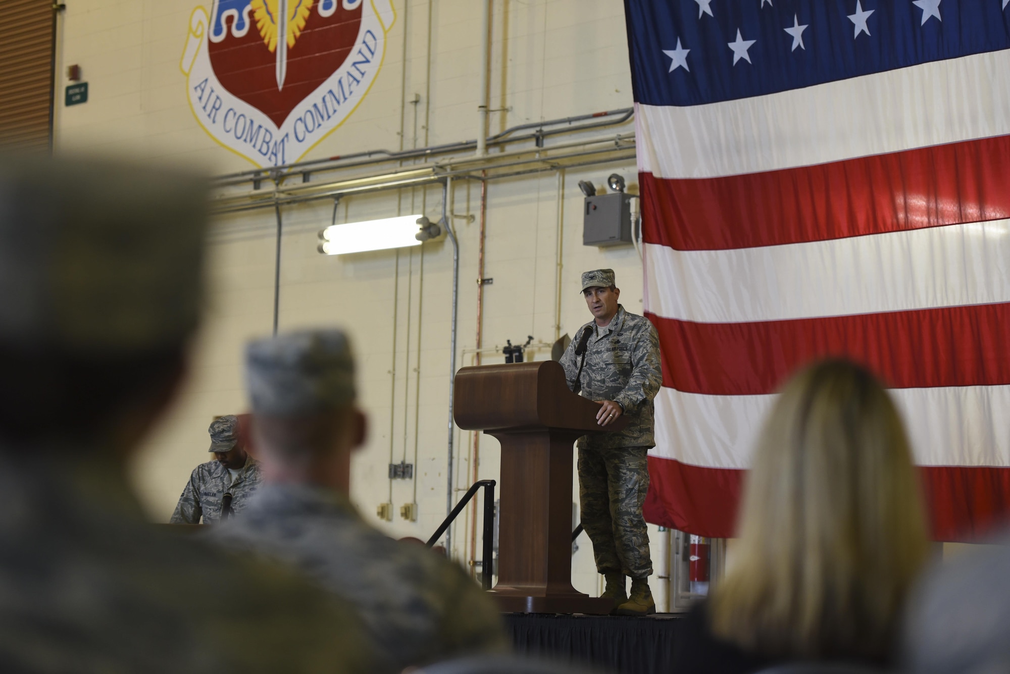 Col. John Chastain III, 23d Maintenance Group commander, praises the accomplishments of the inactive 23d Component and Equipment Maintenance Squadrons during the 23d Maintenance Squadron re-designation ceremony, Nov. 9, 2017, at Moody Air Force Base, Ga. Chastain commended Lt. Col. Neal Van Houten's ability to lead and take command of Air Combat Command’s second largest squadron, guiding the 800 men and women who are responsible for executing safe and reliable maintenance on aircraft systems, ground equipment and munitions to support the 23d Wing's attack and rescue missions. (U.S. Air Force photo by Senior Airman Greg Nash)