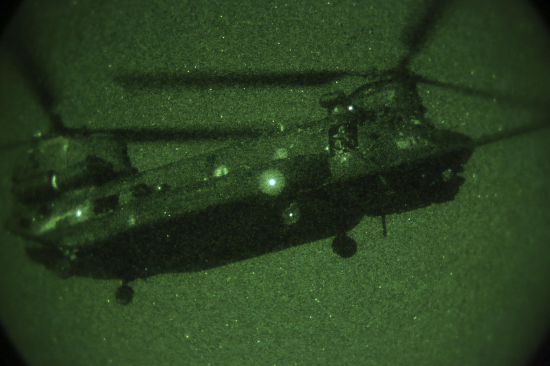 U.S. Army CH-47 helicopter provides air support to Marines from 1st Marine Raider Battalion, U.S. Marine Corps Forces, Special Operations Command and Marines with Marine Air Control Group-28 and 2nd Marine Information Group during a simulated causalty air-evac during a medical training exercise in Hattiesburg, Miss., Nov. 4, 2017.  Marines with MACG-28 and 2nd MIG played the role of partner nation forces during the exercise. Marines with 1st MRB participated in RAVEN 18-02, a 10-day realistic military training exercise designed to assess the Marine Special Operations Companies and Marine Special Operations Teams’ capability to effectively complete their missions.  (U.S. Marine Corps photo by Cpl. Bryann K. Whitley)