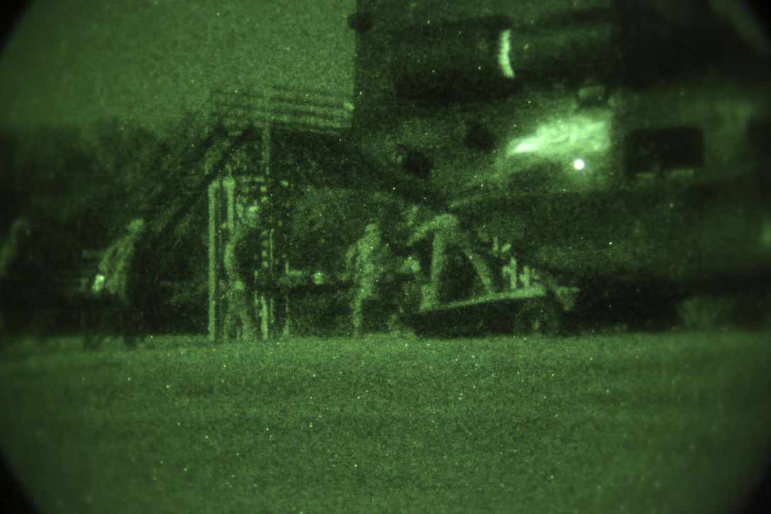 Marines with Marine Air Control Group-28 and 2nd Marine Information Group execute a causalty air-evac with Marines from 1st Marine Raider Battalion, U.S. Marine Corps Forces, Special Operations Command during a medical training exercise in Hattiesburg, Miss., Nov. 4, 2017.  Marines with MACG-28 and 2nd MIG played the role of partner nation forces during the exercise. Marines with 1st MRB participated in RAVEN 18-02, a 10-day realistic military training exercise designed to assess the Marine Special Operations Companies and Marine Special Operations Teams’ capability to effectively complete their missions.  (U.S. Marine Corps photo by Cpl. Bryann K. Whitley)