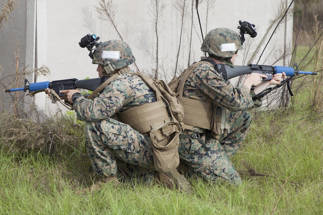 Marines with Marine Air Control Group-28 and 2nd Marine Information Group provide cover during a raid with the guidance of Marines from 1st Marine Raider Battalion, U.S. Marine Corps Forces, Special Operations Command in Hattiesburg, Miss., Nov. 6, 2017.  Marines with 1st MRB participated in RAVEN 18-02, a 10-day realistic military training exercise designed to enhance the battalion’s readiness for upcoming deployments.  Marines with MACG-28 and 2nd MIG played the role of partner nation forces during the exercise. (U.S. Marine Corps photo by Cpl. Bryann K. Whitley)