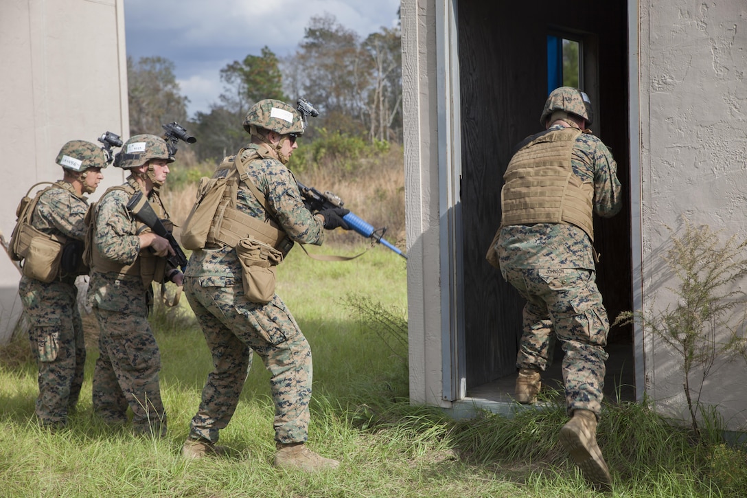 Marines with Marine Air Control Group-28 and 2nd Marine Information Group conduct a simulated high value target detention exercise with the guidance of Marines from 1st Marine Raider Battalion, U.S. Marine Corps Forces, Special Operations Command in Hattiesburg, Miss., Nov. 6, 2017.  Marines with 1st MRB participated in RAVEN 18-02, a 10-day realistic military training exercise designed to enhance the battalion’s readiness for upcoming deployments.  Marines with MACG-28 and 2nd MIG played the role of partner nation forces during the exercise. (U.S. Marine Corps photo by Cpl. Bryann K. Whitley)