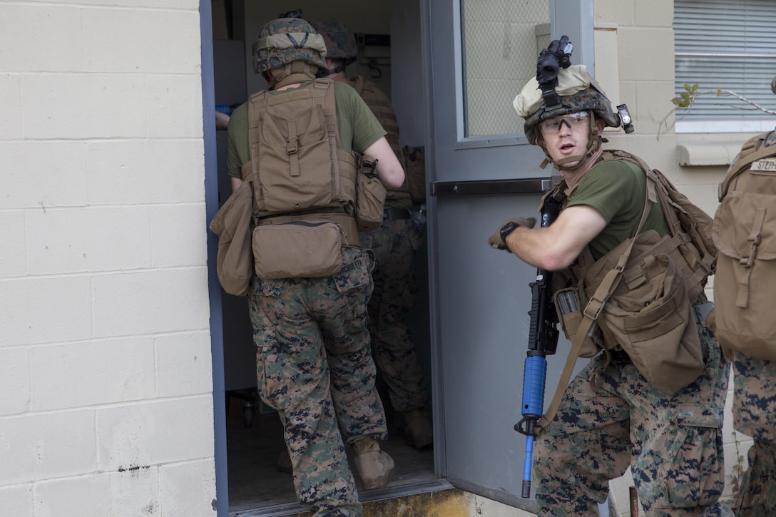 Marines with Marine Air Control Group-28 and 2nd Marine Information Group infiltrate a high value target building during an exercise with Marines from 1st Marine Raider Battalion, U.S. Marine Corps Forces, Special Operations Command in Slidell, La., Nov. 7, 2017.  Marines with 1st MRB participated in RAVEN 18-02, a 10-day realistic military training exercise designed to enhance the battalion’s readiness for upcoming deployments.  Marines with MACG-28 and 2nd MIG played the role of partner nation forces during the exercise. (U.S. Marine Corps photo by Cpl. Bryann K. Whitley)