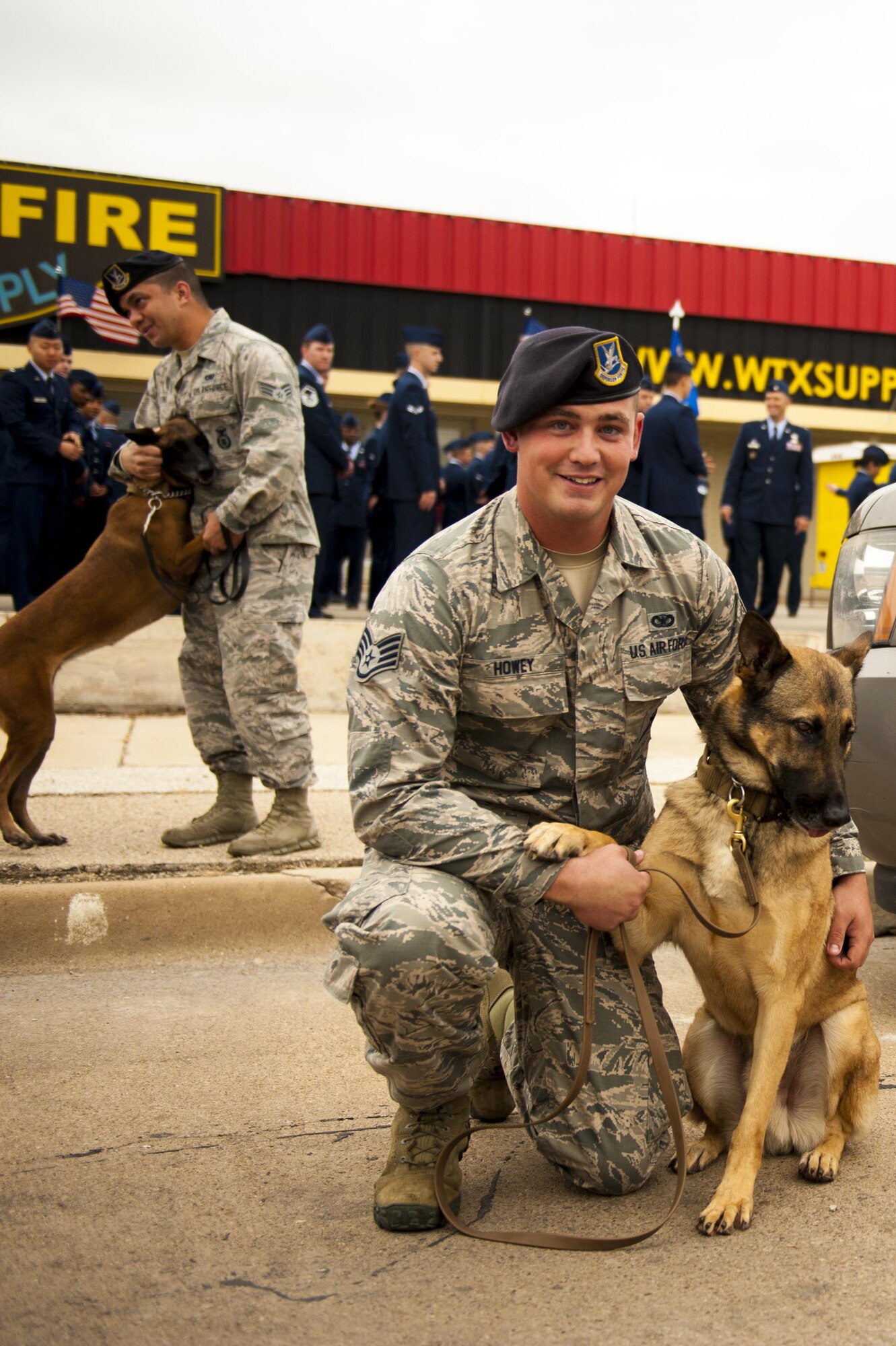 U.S. Air Force Senior Airman Cody Howey, 17th Security Forces Squadron dog handler, poses with his service dog during the Veteran’s Day parade in San Angelo, Texas, Nov. 11, 2017. Over 400 military members participated in the parade. (U.S. Air Force photo by Senior Airman Scott Jackson/Released)