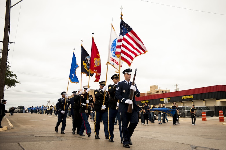 Goodfellow color guard finishes their parade route for the Veteran’s Day parade in San Angelo, Texas, Nov. 13, 2017. Over 400 military members participated in the parade. (U.S. Air Force photo by Senior Airman Scott Jackson/Released)