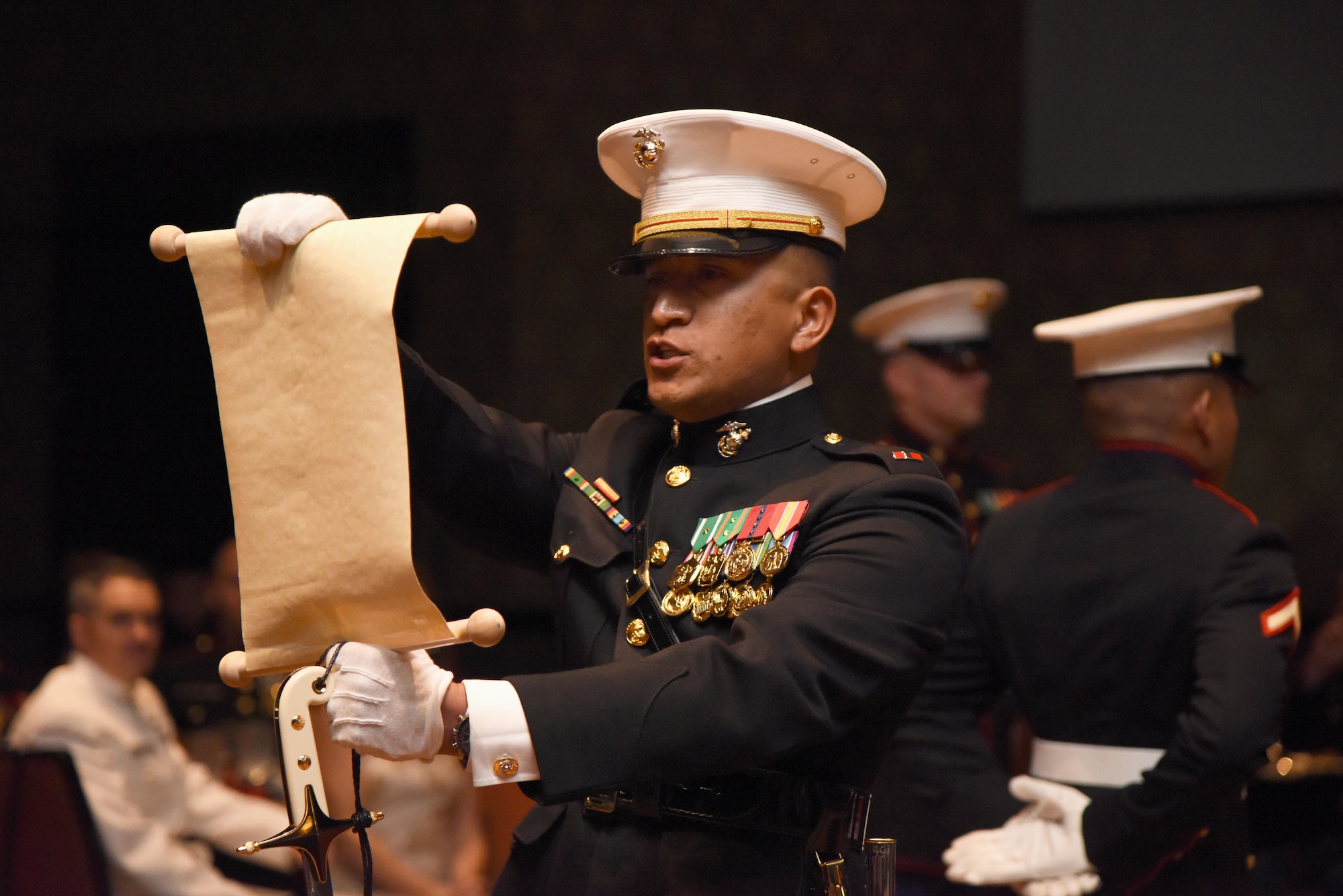 Chief Warrant Officer 3 Andres Madera, Keesler Marine Detachment meteorology and oceanography analyst forecaster course officer in charge, reads a birthday message from Gen. John A. Lejeune during the 242nd Marine Corps Birthday Ball at the Golden Nugget Casino Nov. 10, 2017, in Biloxi, Mississippi. More than 300 service members and guests attended the Keesler Marine Detachment-hosted event. (U.S. Air Force photo by Kemberly Groue)