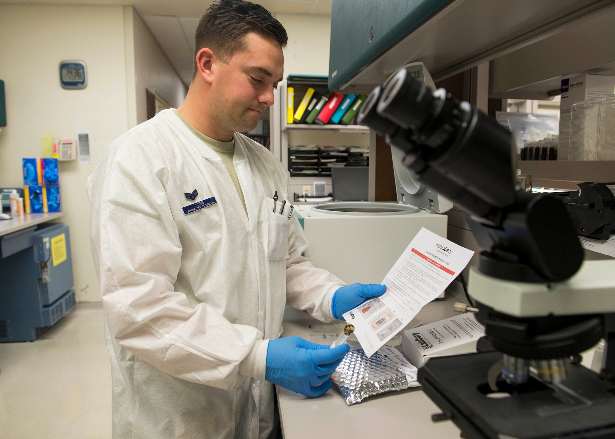 Senior Airman Zachary Lunn, 673d Medical Group medical laboratory technician, reads information for a LabCorp InformaSeq kit at Joint Base Elmendorf-Richardson, Alaska, Nov. 7, 2017. Beginning in October 2017, the 673d MDG Women’s Health Clinic replaced the Natera prenatal Panorama testing with LabCorps’ InformaSeq prenatal testing.