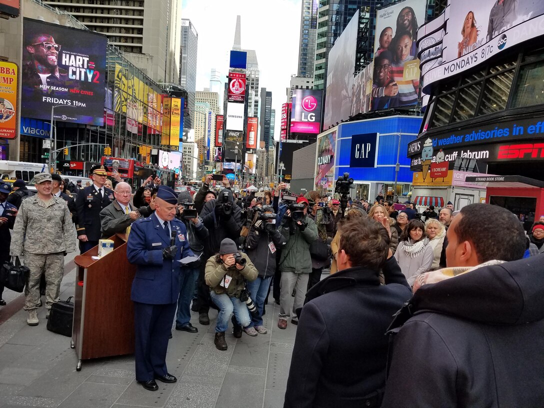 Major General Garrett Harencak, Commander, Air Force Recruiting Service, swears in new recruits at the Times Square Ribbon Cutting Ceremony