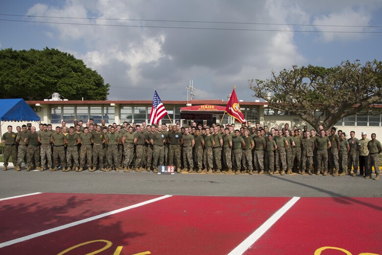MCAS FUTENMA, OKINAWA, Japan— Marines and sailors pose for a group photo after the 242-mile Birthday Run on Marine Corps Air Station Futenma, Okinawa, Japan.