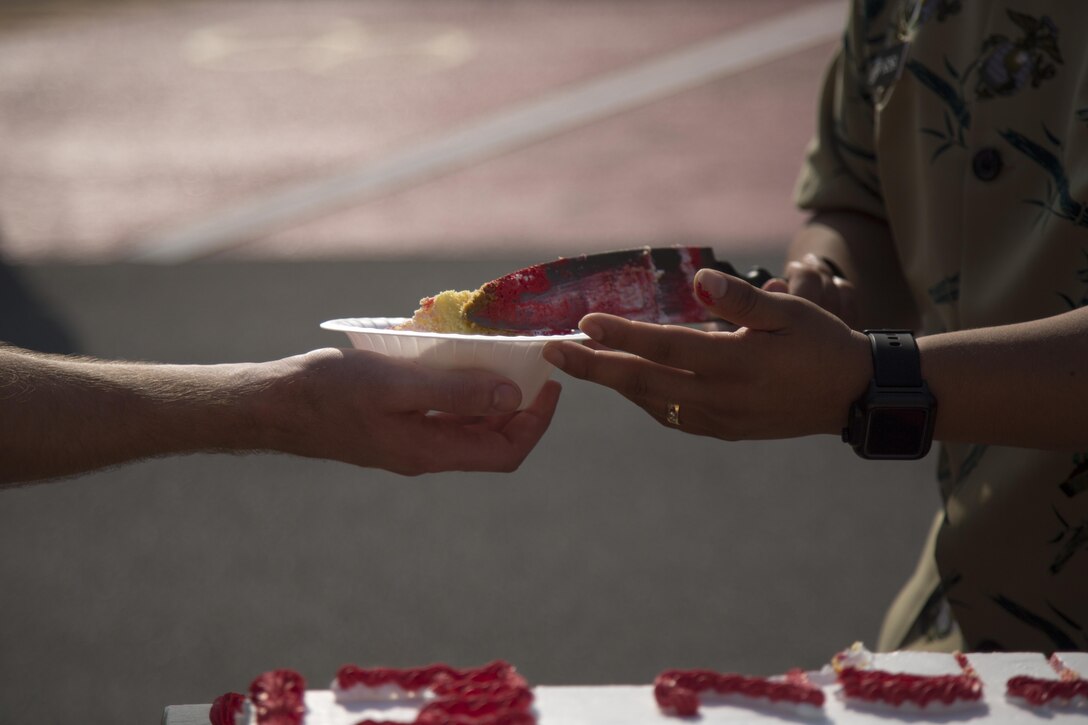 MCAS FUTENMA, OKINAWA, Japan— Marines are served cake after the 242-mile Birthday Run on Marine Corps Air Station Futenma, Okinawa, Japan.