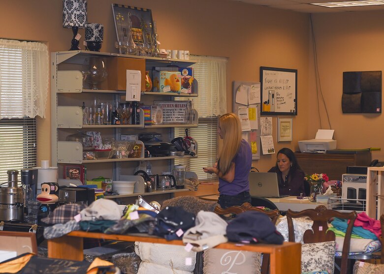 (From left) Dana Wacks, Langley Thrift Shop volunteer, and Heather Alvarado, Langley Thrift Shop manager, organize merchandise at Joint Base Langley-Eustis, Va., Oct. 12, 2017.