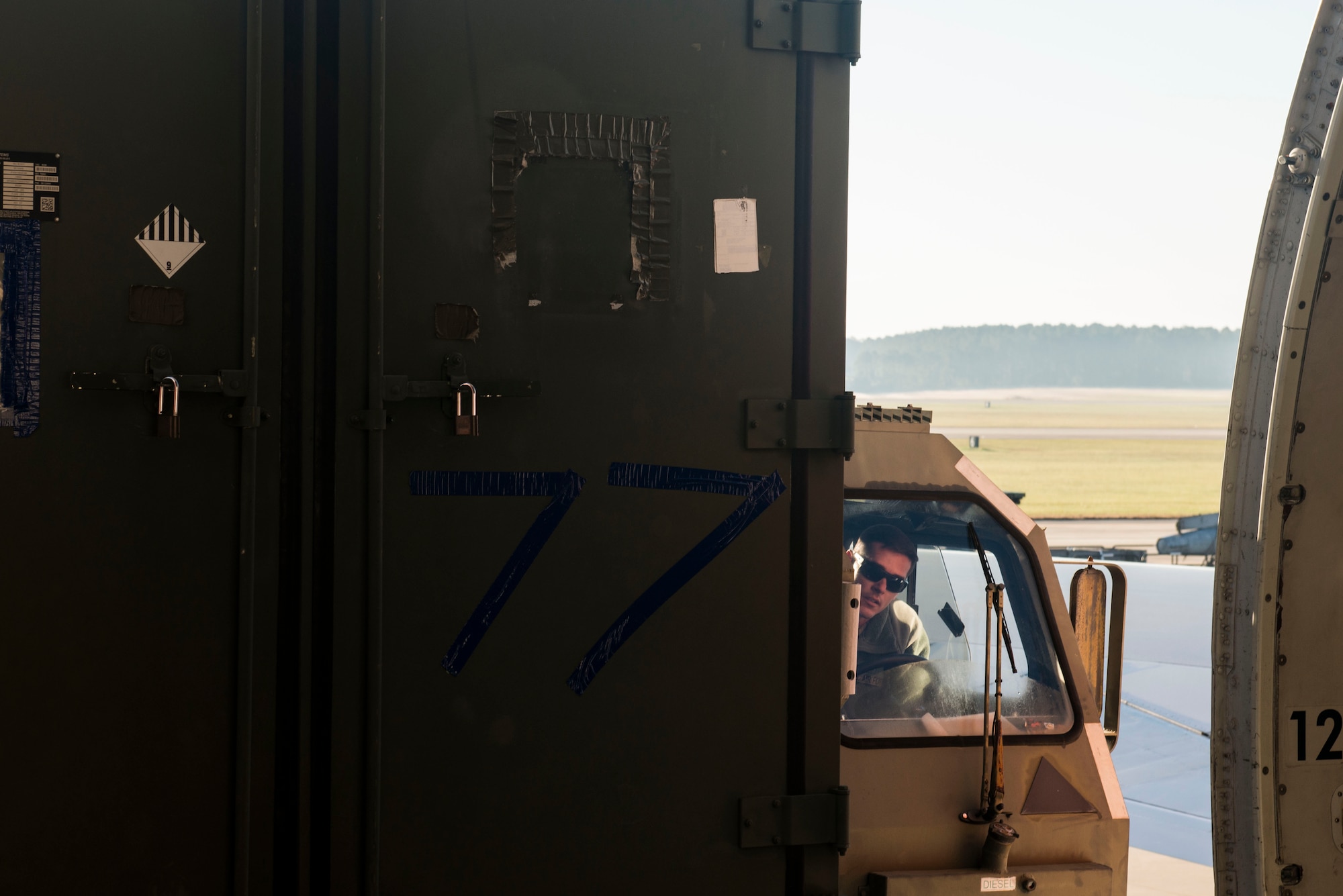 U.S. Air Force Tech. Sgt. Stephen Lacey, 20th Logistics Readiness Squadron air transportation specialist, loads cargo onto a Boeing 747 while operating a k-loader at Shaw Air Force Base, South Carolina, Nov. 1, 2017.