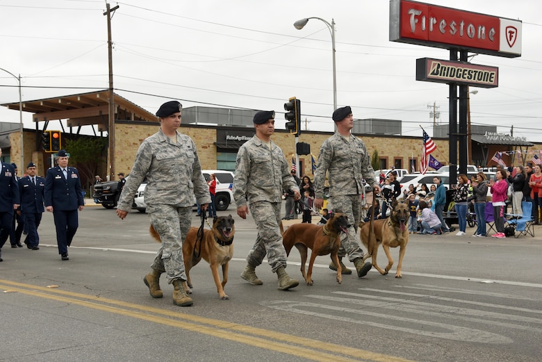17th Security Forces Squadron military working dogs and their handlers from Goodfellow Air Force Base march in San Angelo’s Veteran’s Day Parade Nov. 11, 2017, San Angelo, Texas.