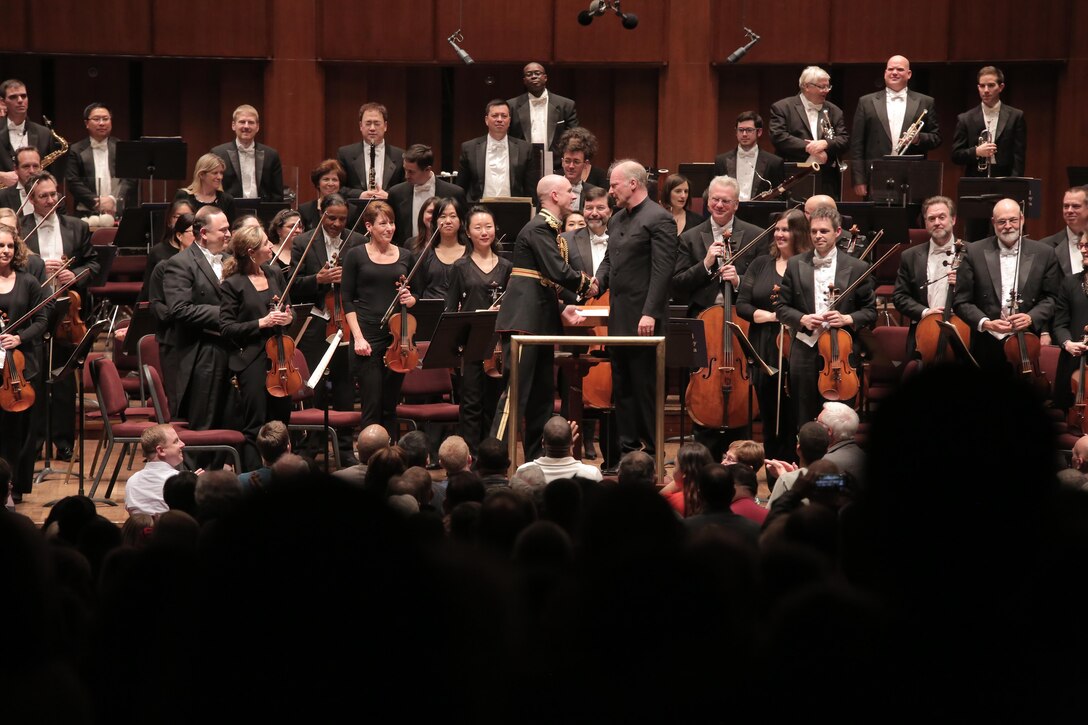 On Nov. 10, 2017, the U.S. Marine Band and the National Symphony Orchestra presented a concert titled “Notes of Honor.” The joint concert, held at the Kennedy Center Concert Hall in Washington, D.C., was conducted by Gianandrea Noseda and Col. Jason K. Fettig. (U.S. Marine Corps photo by Master Sgt. Amanda Simmons/released)