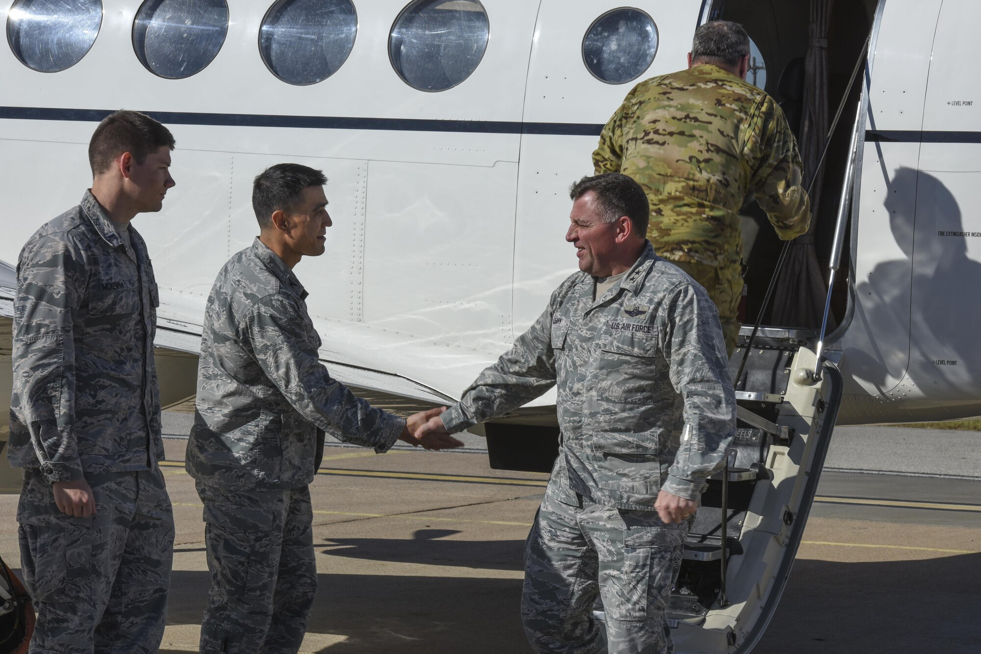 U.S. Air Force 1st Lt. Joseph McKenna, Communication Squadron officer in charge, and Col. Ricky Mills, 17th Training Wing commander, greet Maj. Gen. Timothy Leahy, 2nd Air Force commander at Mathis Field airport in San Angelo, Texas, Nov. 1, 2017. Leahy was visiting all Air Education and Training Command bases which included a three day visit to Goodfellow Air Force Base.
