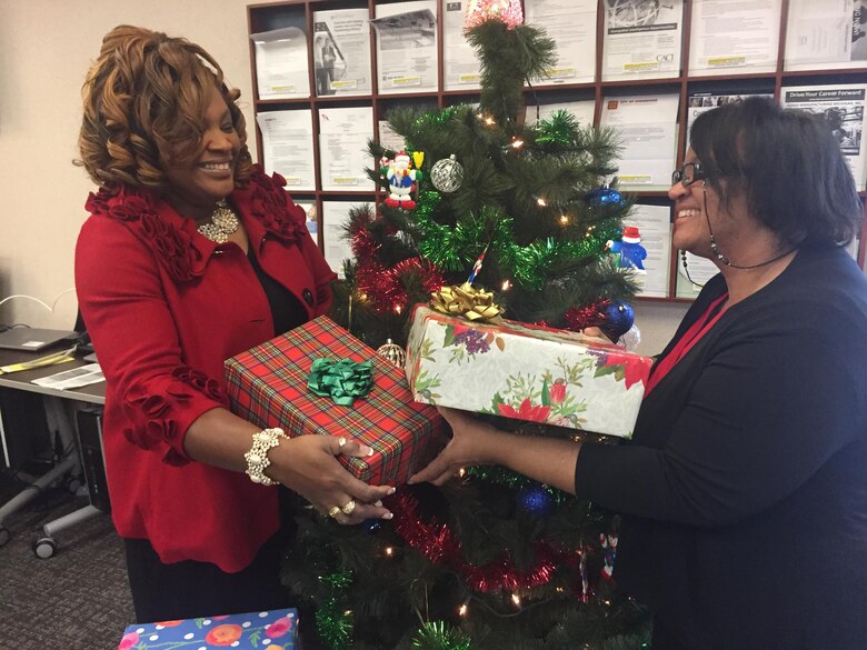 Community readiness specialists Sharron Griffin-Gorham, left, and Jackie Shazor are asking the Wright-Patterson Air Force Base community to support this year’s Adopt-A-Family Holiday Program. (Skywrighter photo/Amy Rollins)