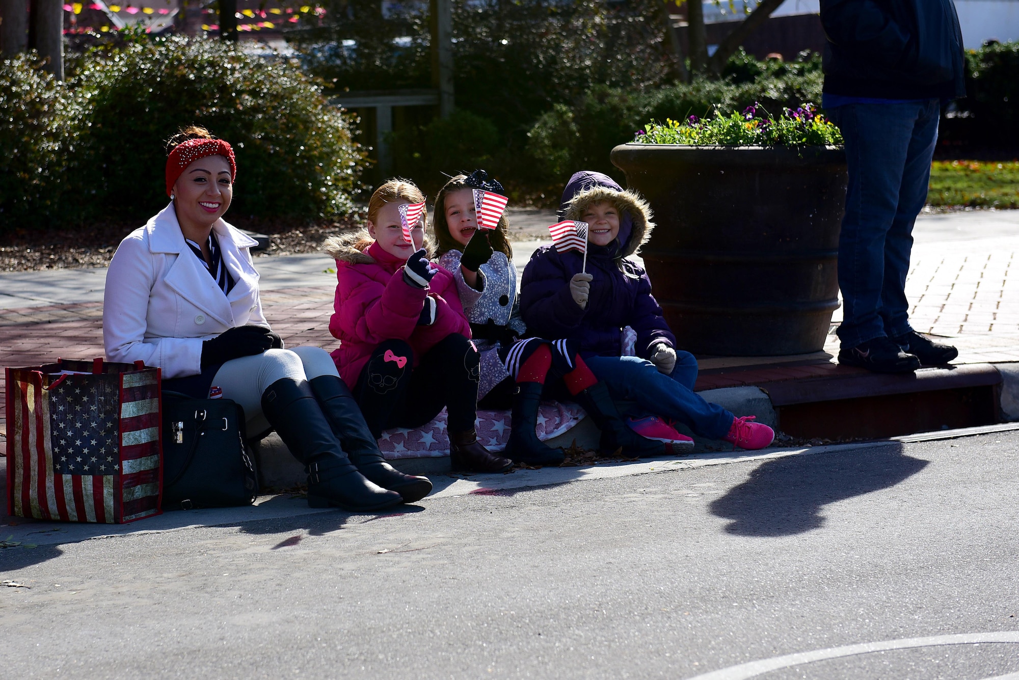 A group of bystanders watch the Wayne County Veterans Day Parade, Nov. 11, 2017, in Goldsboro, North Carolina. Over 50 clubs and organizations marched in the parade, including 149 Airmen from Seymour Johnson Air Force Base, North Carolina. (U.S. Air Force photo by Airman 1st Class Kenneth Boyton)