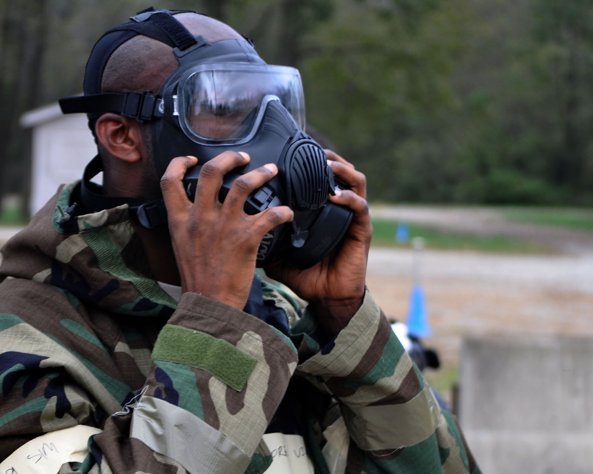 Senior Airman Urowayinor Dore, 445th Civil Engineer Squadron HVAC apprentice, removes his gas mask during Ability to Survive and Operate training conducted at the Wright-Patterson Air Force Base Warfighter Training Center Oct. 15, 2017.