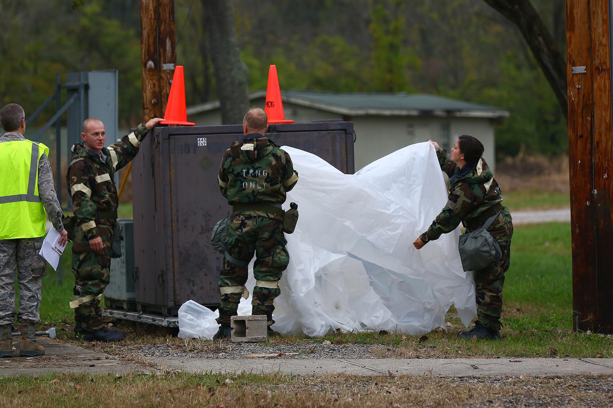 Senior Master Sgt. Scott Bunch, 445th Aircraft Maintenance Squadron, leads his team during an ATSO training exercise as they cover a simulated “critical asset” prior to a suspected chemical attack.