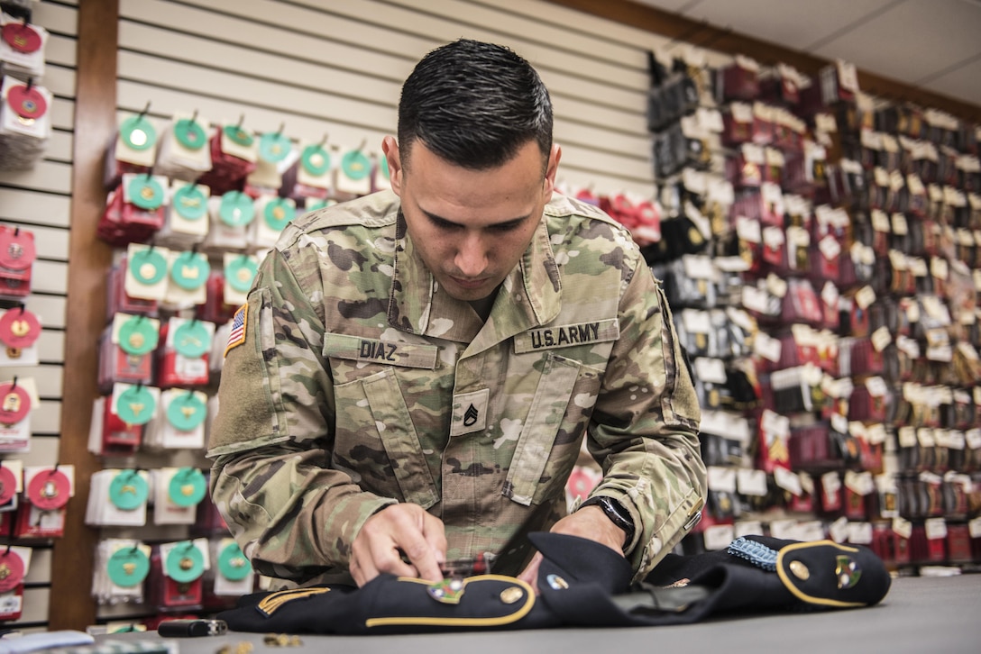Army Reserve Staff Sgt. Luis Diaz assembles a dress uniform for use during mortuary affairs operations at the Charles C. Carson Center at Dover Air Force Base, Del., Oct. 24, 2017. The Charles C. Carson Center is home to the Port Mortuary, which is responsible for returning all Defense Department service members, civilians and contractors who perish during contingency operations overseas. Army photo by Master Sgt. Brian Hamilton