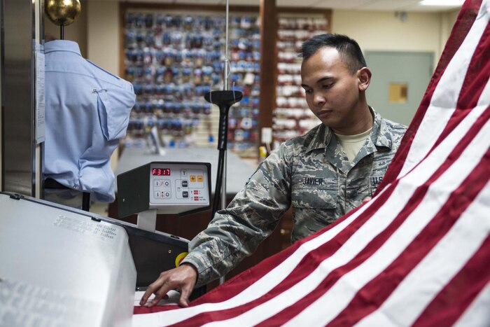 A man holds an American flag.