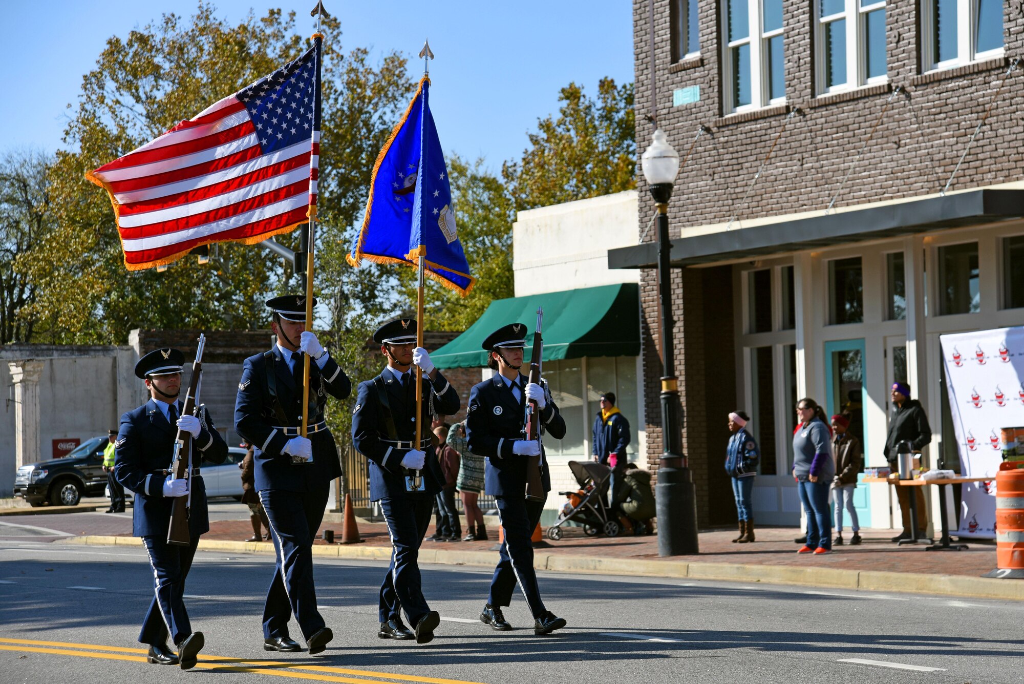 U.S. Airmen assigned to the 20th Force Support Squadron Honor Guard march during a Veterans Day Celebration parade in Sumter, South Carolina, Nov. 11, 2017.