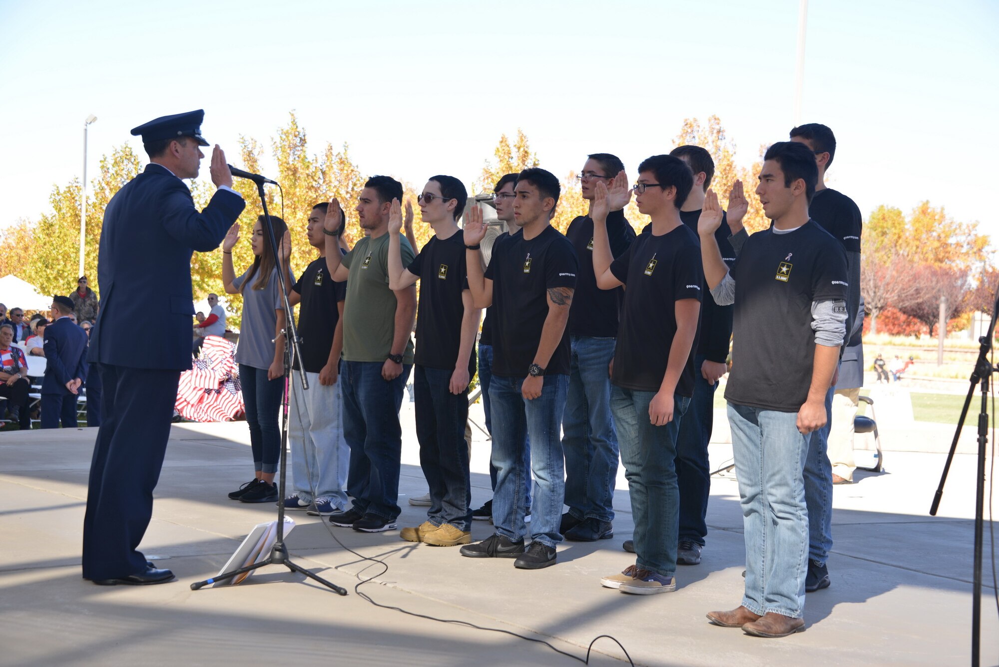 Maj. Gen. Matthew Molloy, Air Force Operational Test and Evaluation Center commander, administers to enlistment oath to new Army recruits at the Veterans Day Ceremony Nov. 11 at the New Mexico Veterans Memorial.