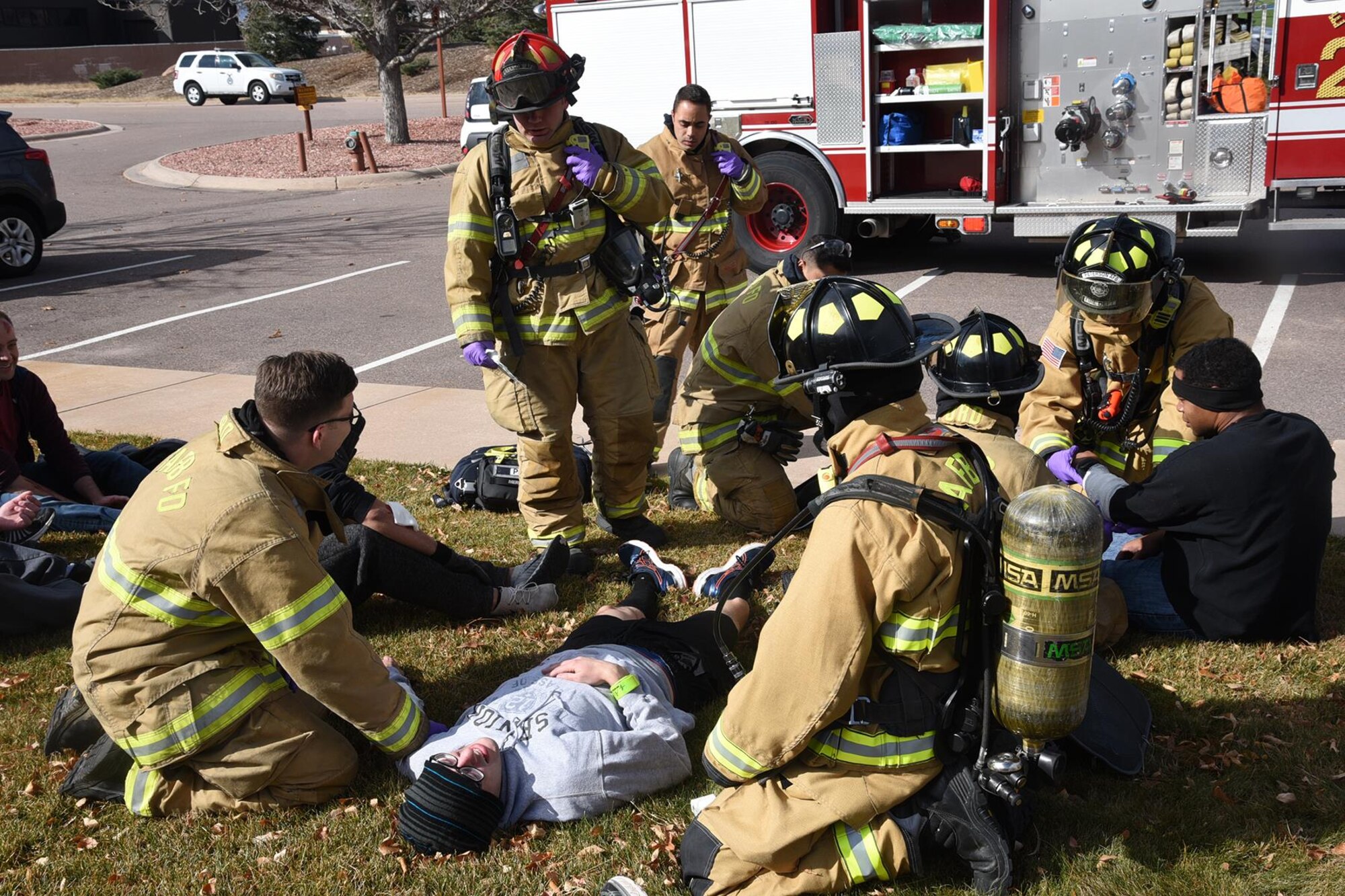21st Civil Engineer fire department Airmen tend to the wounded during a Condor Crest exercise at Peterson Air Force Base, Colorado, Nov. 9, 2017. Condor Crest is an exercise that tests Airmen’s readiness and vulnerability at the 21st Space Wing. (U.S. Air Force photo by Robb Lingley)