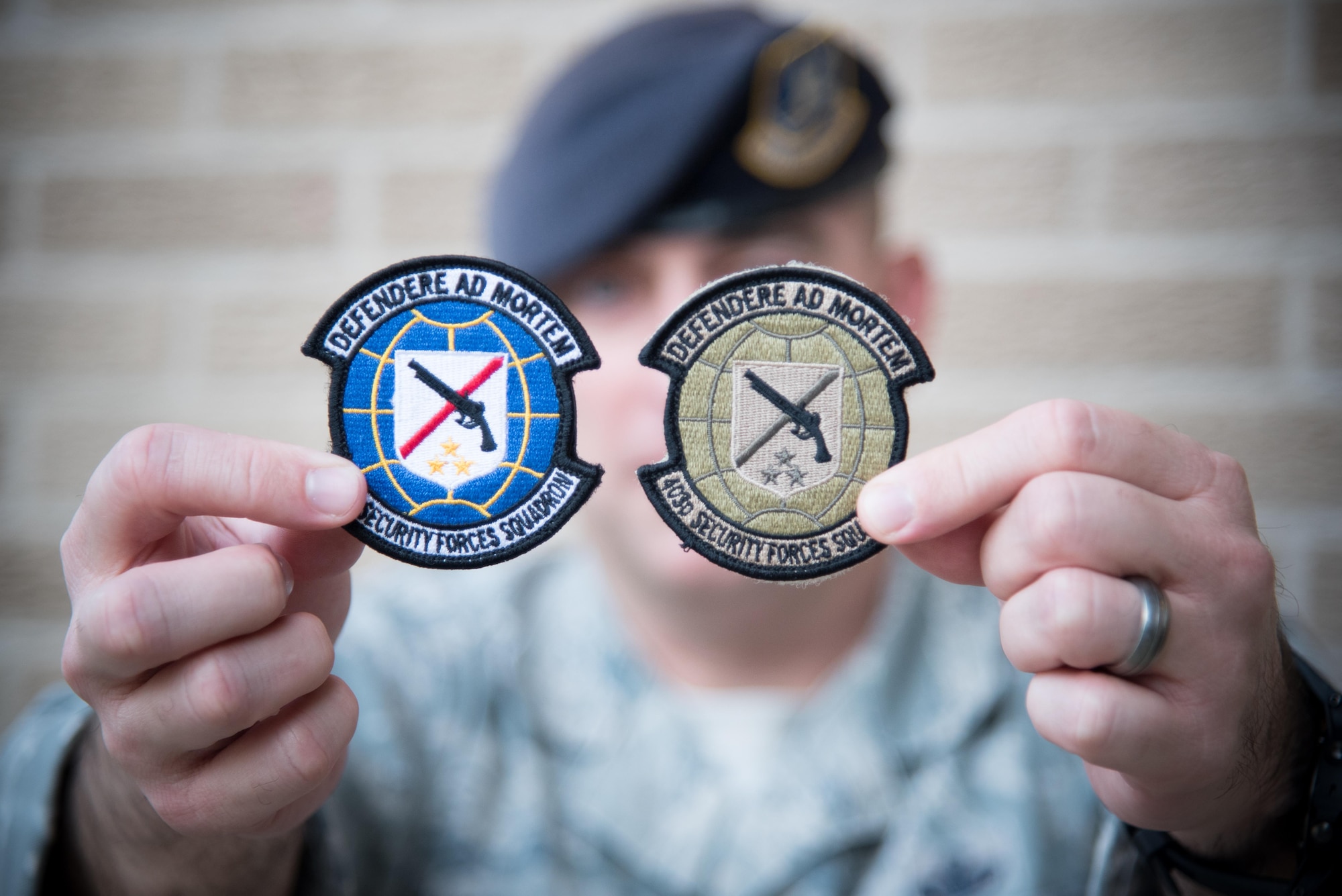 Master Sgt. Lucas Applewhite, 403rd Security Forces Squadron action officer, displays the new 403rd SFS unit patch Nov. 7, 2017 at Keesler Air Force Base, Mississippi. (U.S. Air Force photo by Staff Sgt. Heather Heiney)