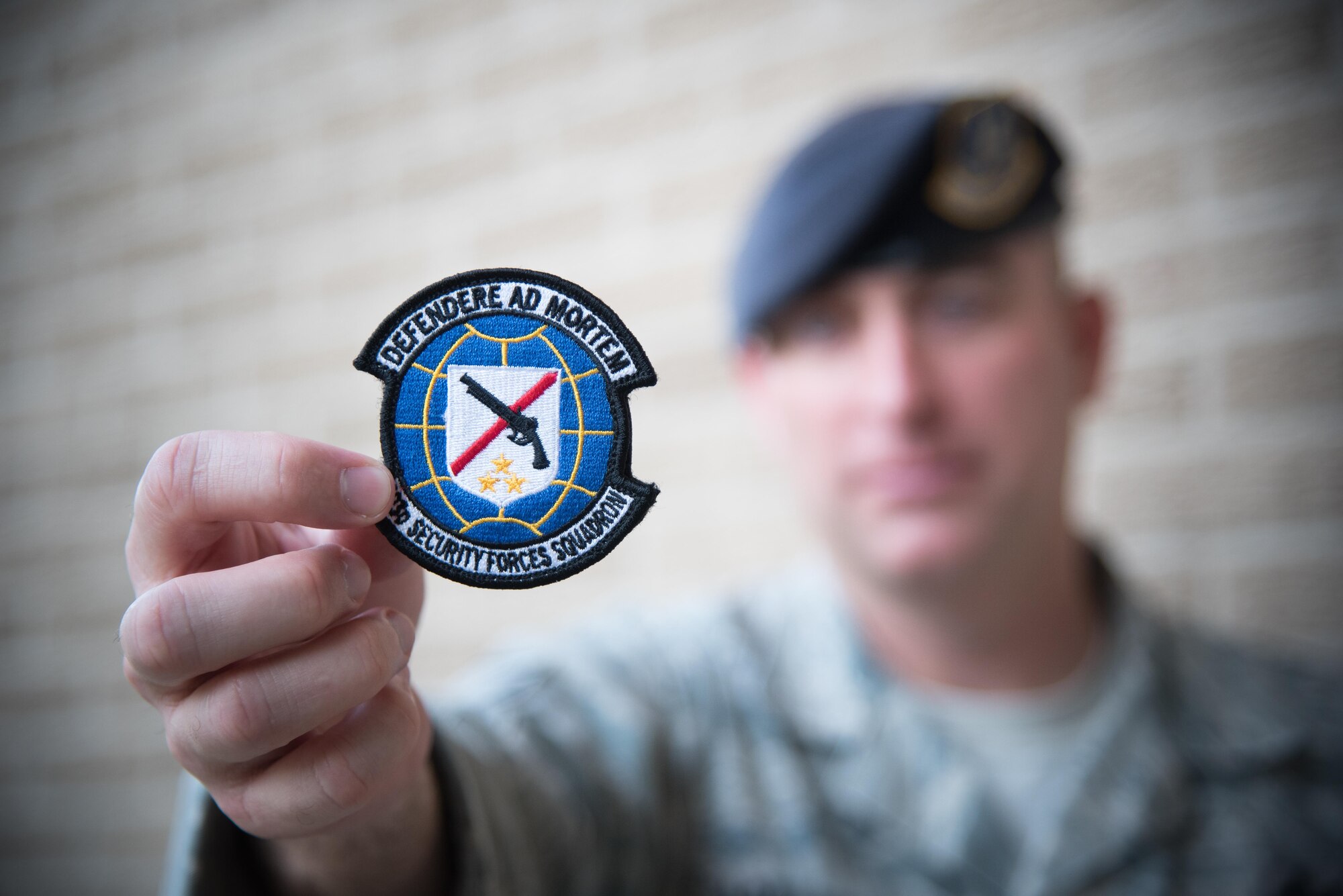 Master Sgt. Lucas Applewhite, 403rd Security Forces Squadron action officer, displays the new 403rd SFS unit patch Nov. 7, 2017 at Keesler Air Force Base, Mississippi. (U.S. Air Force photo by Staff Sgt. Heather Heiney)