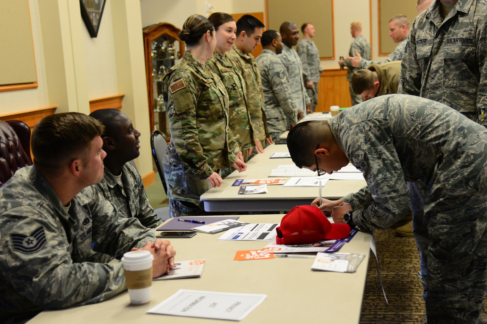 Airmen from the 819th RED HORSE Squadron representing the Combined Federal Campaign assist Airmen in volunteering at or donating to organizations Nov. 14, 2017, at Malmstrom Air Force Base, Mont. This year, CFC added volunteering opportunities for individuals to donate time to organizations of their choice. (U.S. Air Force photo by Airman 1st Class Tristan Truesdell)