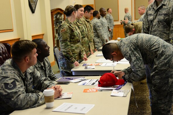 Airmen from the 819th RED HORSE Squadron representing the Combined Federal Campaign assist Airmen in volunteering at or donating to organizations Nov. 14, 2017, at Malmstrom Air Force Base, Mont. This year, CFC added volunteering opportunities for individuals to donate time to organizations of their choice. (U.S. Air Force photo by Airman 1st Class Tristan Truesdell)