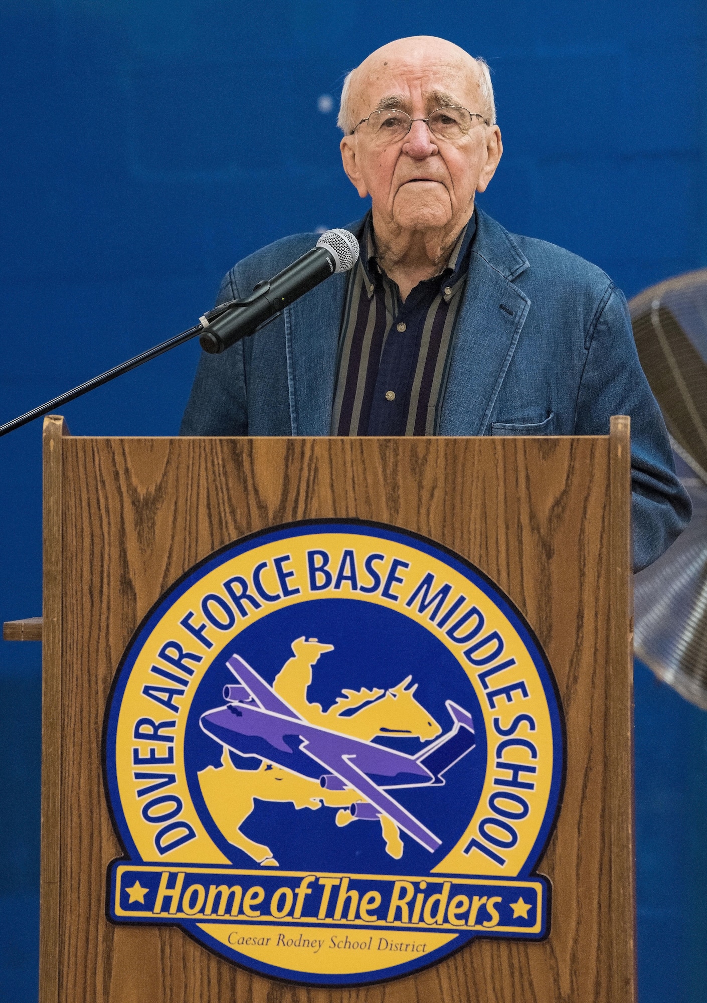 Retired Lt. Col. Clarence Wolgemuth briefly addresses attendees, students and faculty during an assembly in the gymnasium Nov. 9, 2017, at Dover Air Force Base Middle School on Dover AFB, Del. Wolgemuth was recognized as the DAFBMS Veteran of Honor for 2017. (U.S. Air Force photo by Roland Balik)