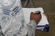 Senior Airman Gerald Mackey, Jr., the Honor Guard flight trainer assigned to the 28th Munitions Squadron, takes notes on the United States Air Force Honor Guard procedures at the Pride Hangar at Ellsworth Air Force Base, S.D., Oct. 26, 2017. The new procedures taught were immediately directed to the honor guard flights that did not participate in the week long course. (U.S. Air Force photo by Airman Nicolas Z. Erwin)